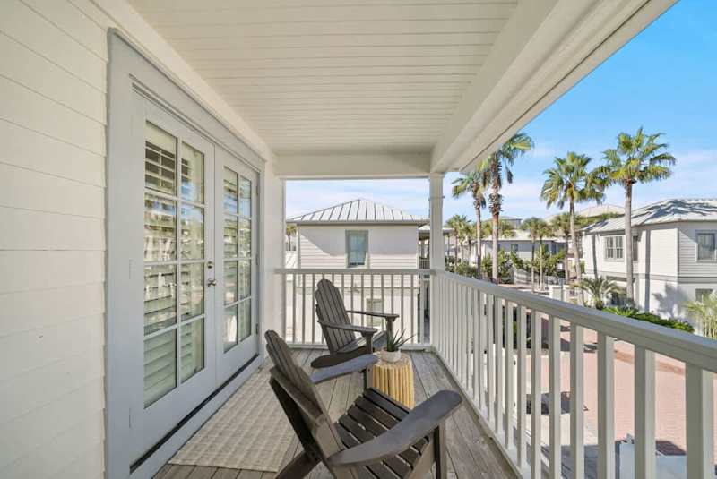 Second floor balcony features multiple seating options.