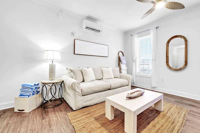 Living area features a queen sleeper sofa.