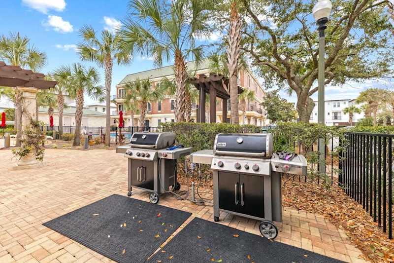 Gas grills by community pool.
