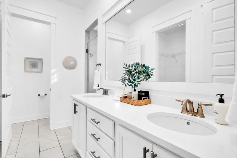 Ensuite features dual vanities and a walk-in shower.