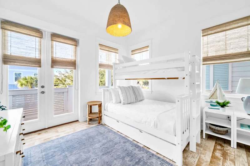 Guest bedroom features a twin over full bunk with a twin trundle and a smart tv.