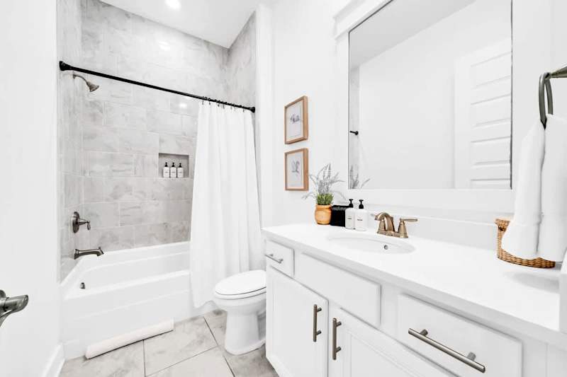 Hall bath features a shower/tub combo.