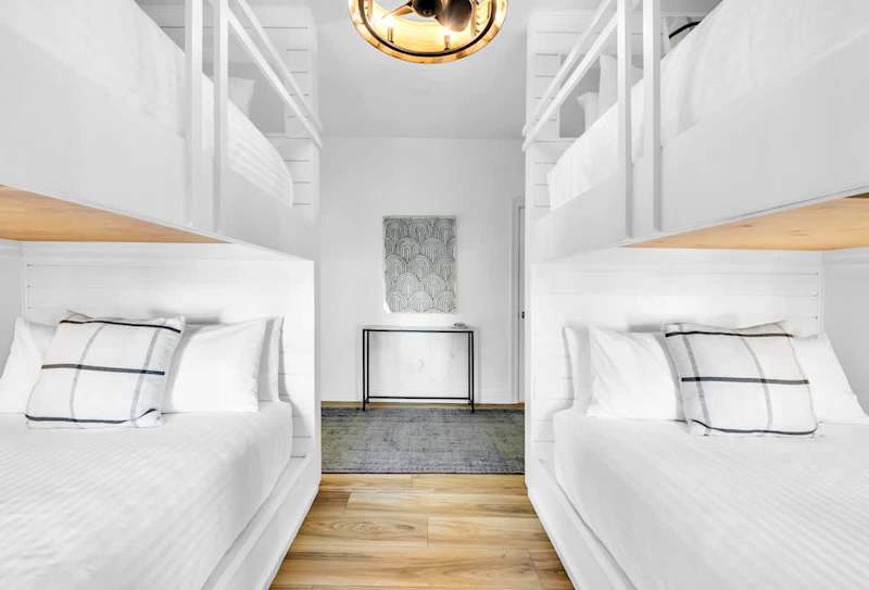 Bedroom #4 located on the 1st floor features (2) queen over queen bunk beds with a smart tv.