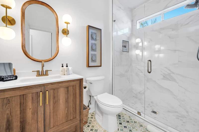 First floor hall bath #1 features a large walk-in shower.