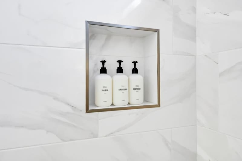 All bathrooms throughout the home feature shower amenities.