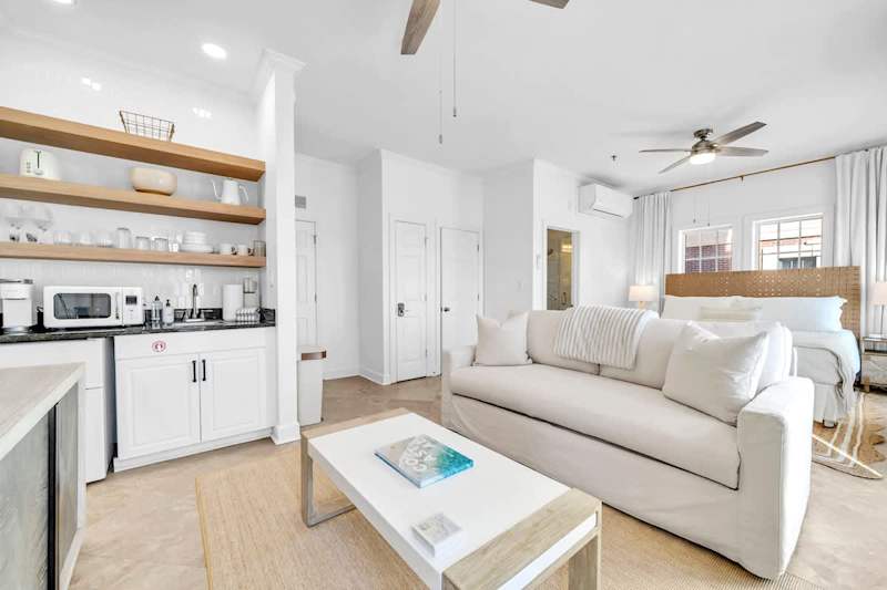 Condo features an open concept floor plan complete with a smart tv.
