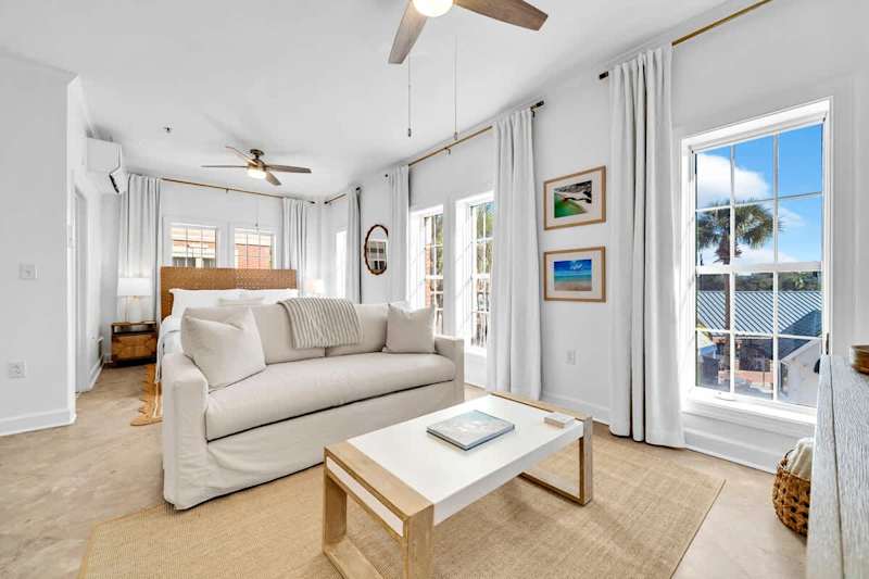 Living area features a queen sleeper sofa.