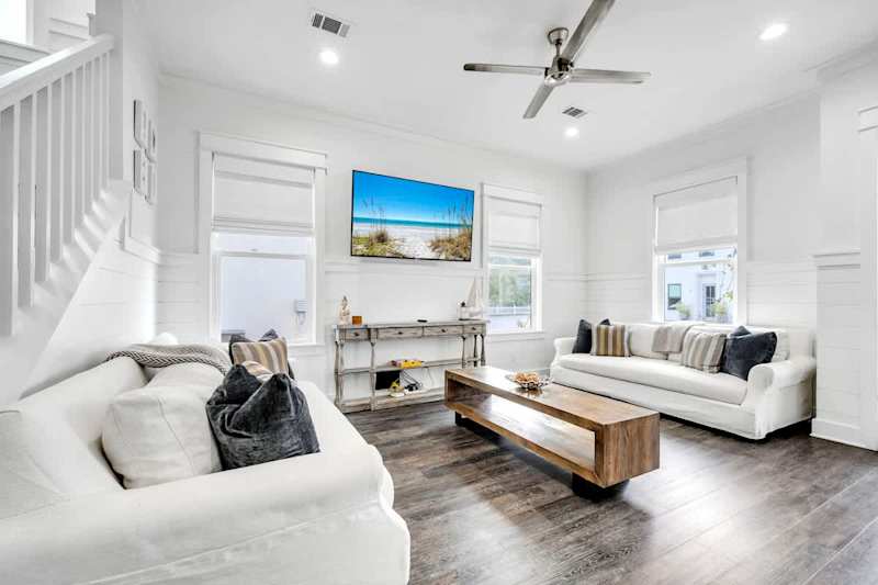 Living room features comfy seating and a Smart tv!