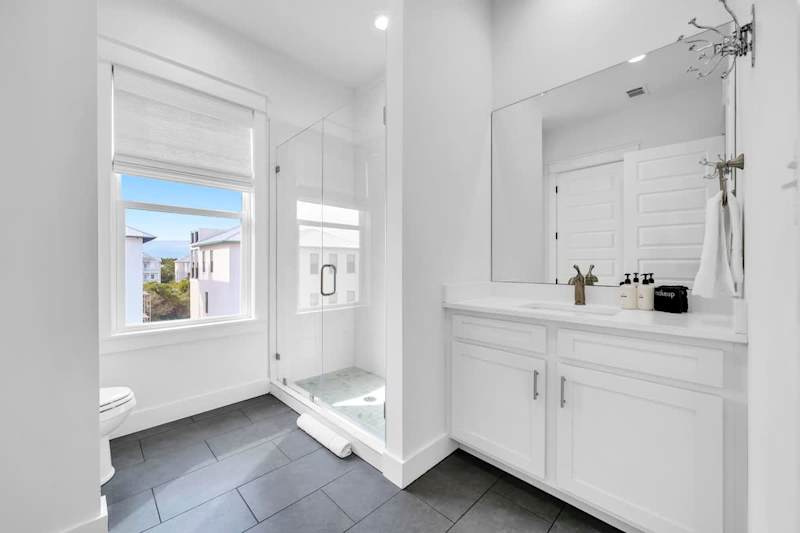 Third-floor shared bathroom with a walk-in shower.