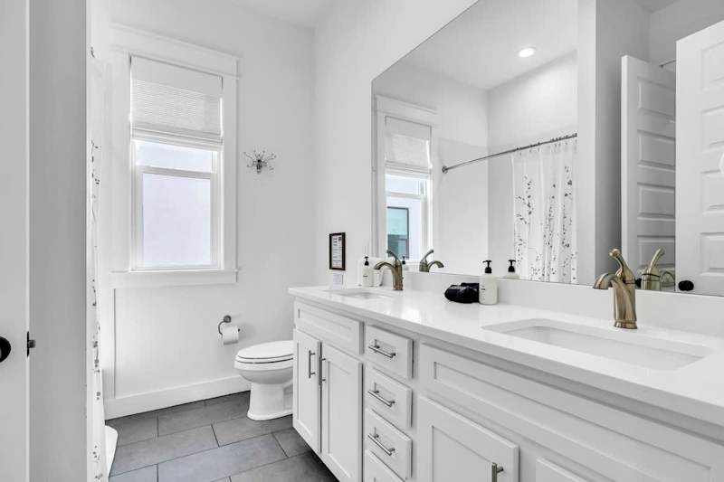 Second-floor shared bathroom with a shower + tub combo.