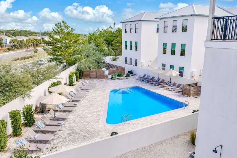Heated communal pool with lounge seating.