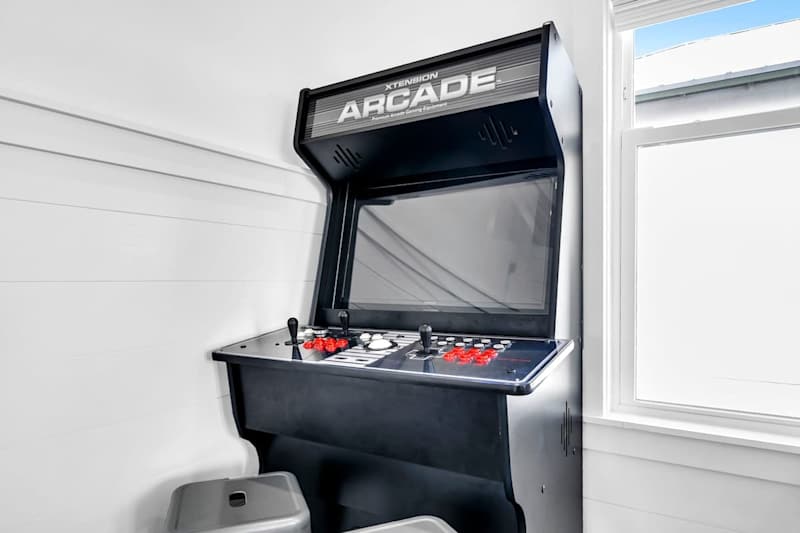 Game on! Third-floor living space with an arcade machine.