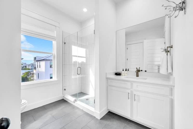 Third-floor shared bathroom with a walk-in shower.