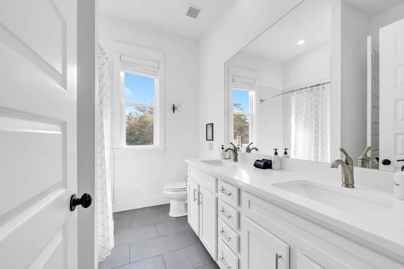 Second-floor shared bathroom with a shower + tub combo.