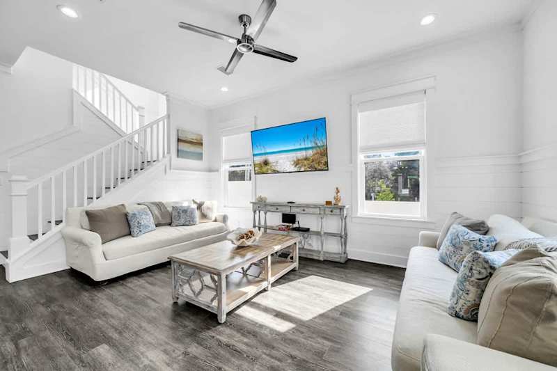 Living room features comfy seating and a Smart tv!