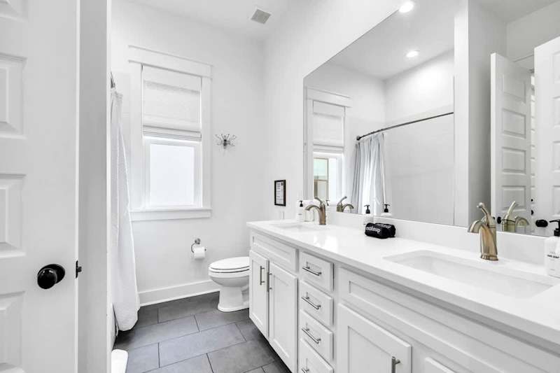 Second-floor shared bathroom with a shower + tub combo.