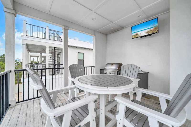 Outdoor seating with grill and tv!