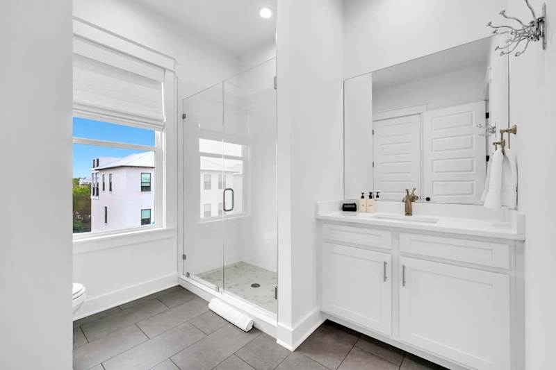 Third-floor shared bathroom with a walk-in shower.
