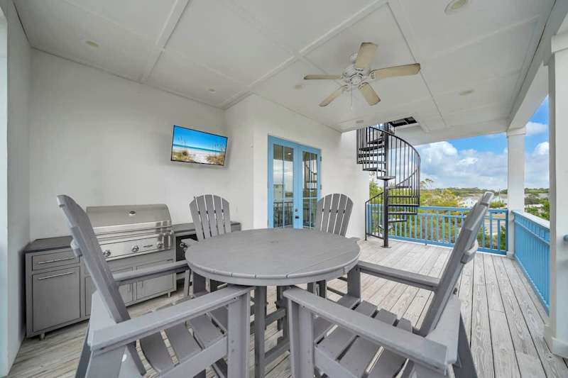 Third floor balcony retreat with seating and an outdoor grill!
