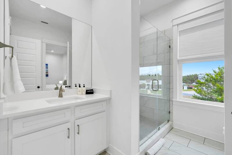 Third-floor shared bathroom with a walk-in shower.