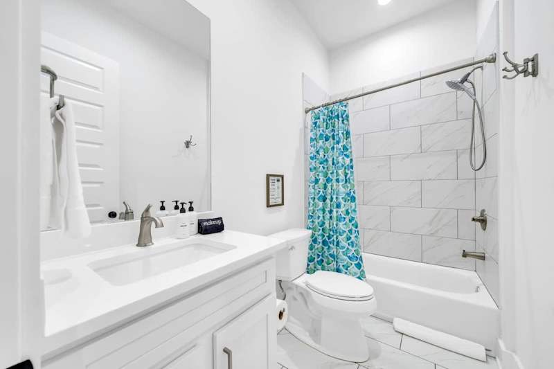 Second-floor shared bathroom with a shower + tub combo.