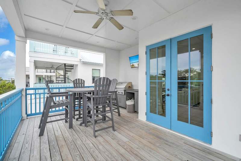 Third floor balcony retreat with seating and an outdoor grill!