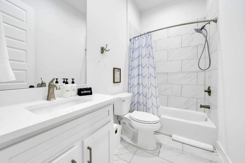 Second-floor shared bathroom with a shower + tub combo.