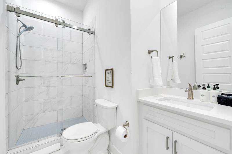 Second-floor shared bathroom with a walk-in shower.