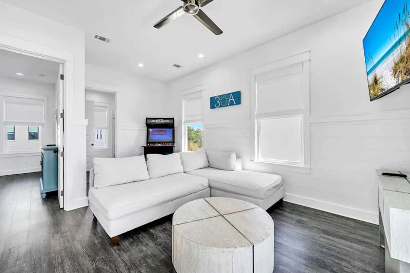 Third floor living features an arcade game & smart tv