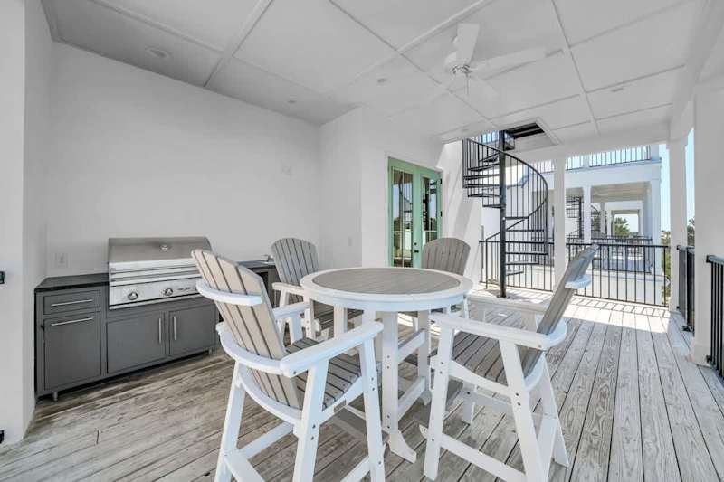 Private covered deck with grill and seating