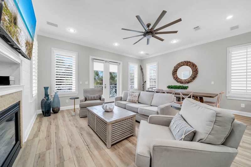 Living room includes plenty of seating for all, including queen sleeper sofa.