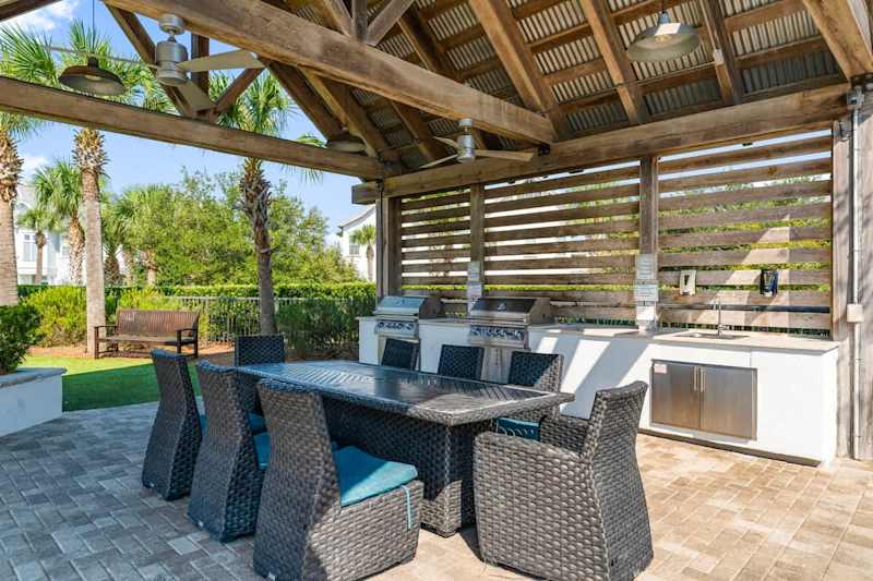 Community dining space and gas grills.