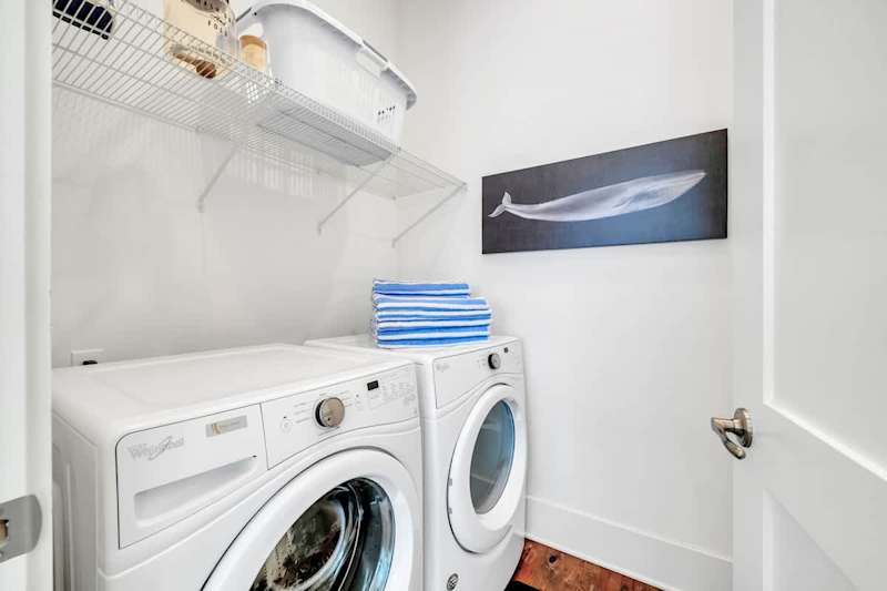 Laundry room features washer and dryer