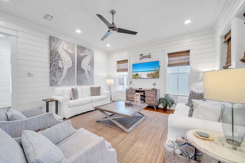 Living room includes plenty of seating for all with smart tv