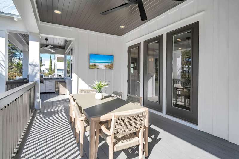 Outdoor covered deck features built-in gas grill