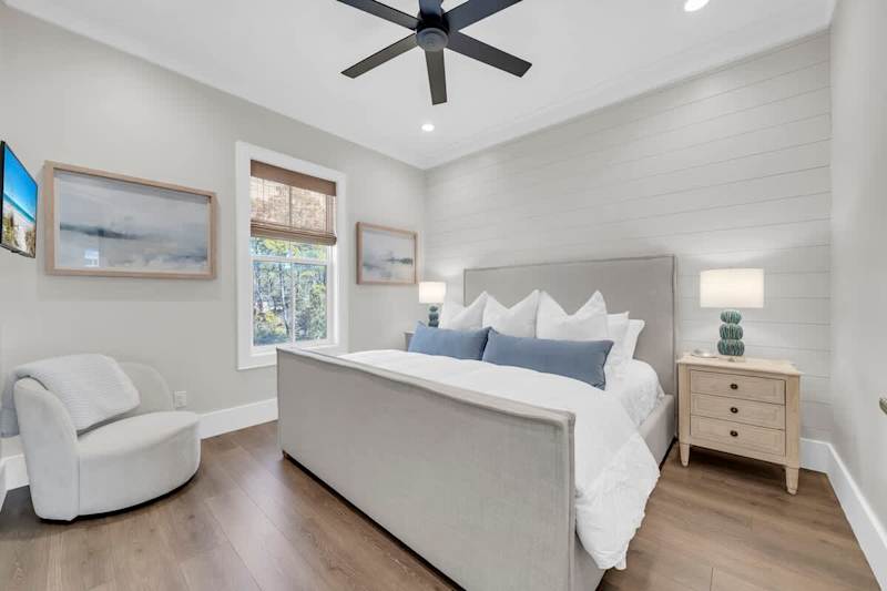 Bedroom #6 is in the carriage house features a king bed and smart tv.