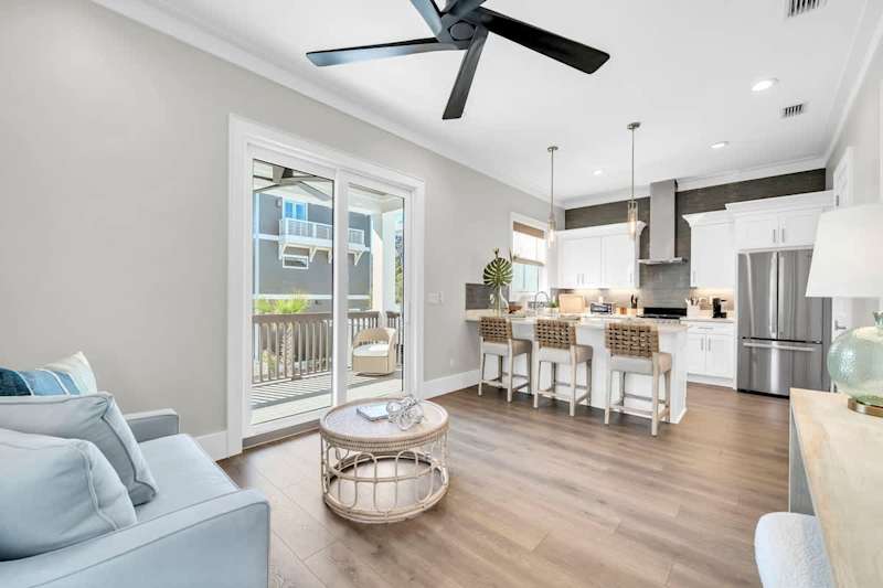 Carriage house features open living and dining, equipped with a fully stocked kitchen