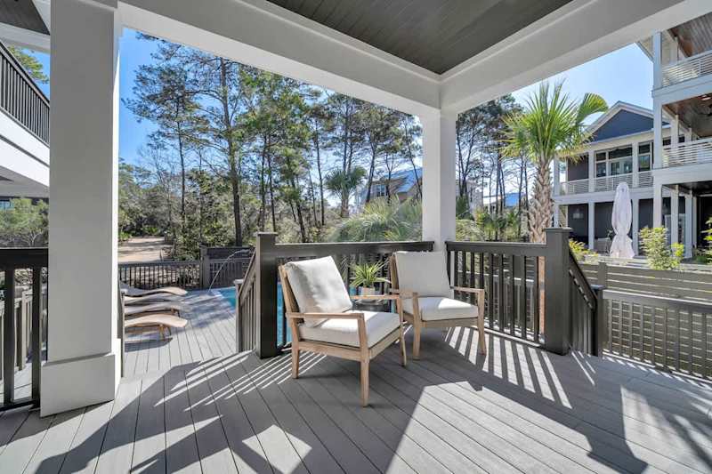 Private covered deck with outdoor seating