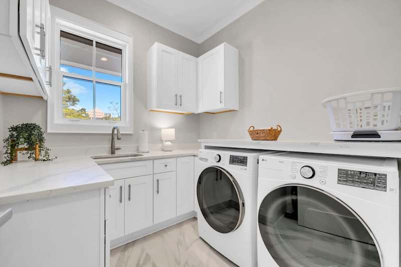 Second floor features a laundry room with full washer and dryer