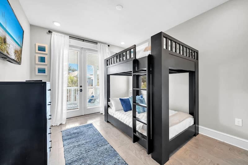 Bedroom #3 features a double/double bunk, smart tv and access to private porch