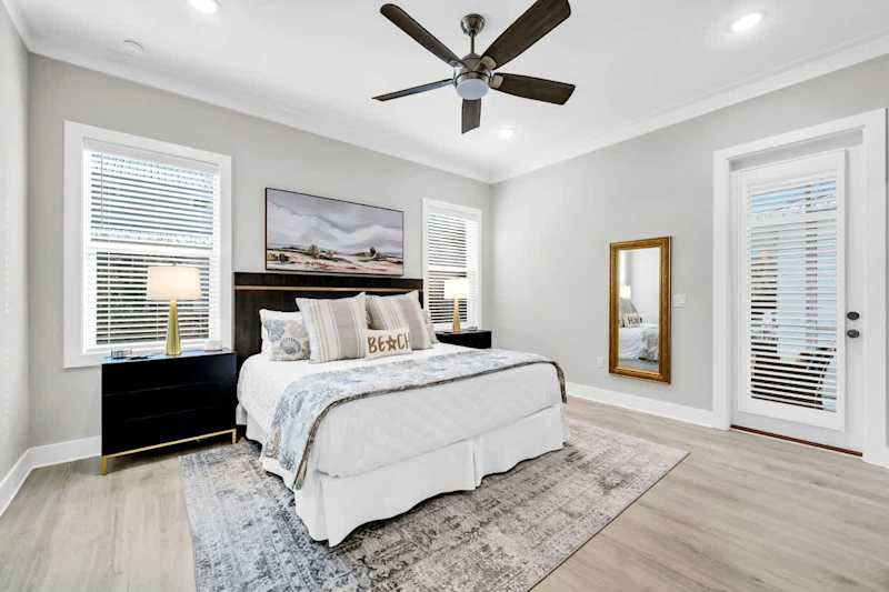 Bedroom #1 features a king with smart tv, walk-in closet, access to porch and ensuite.