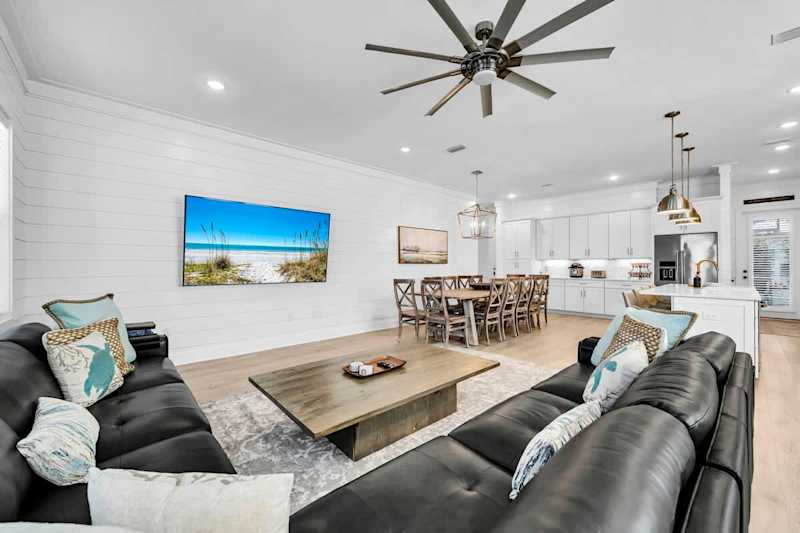 Open concept main floor living space with smart tv