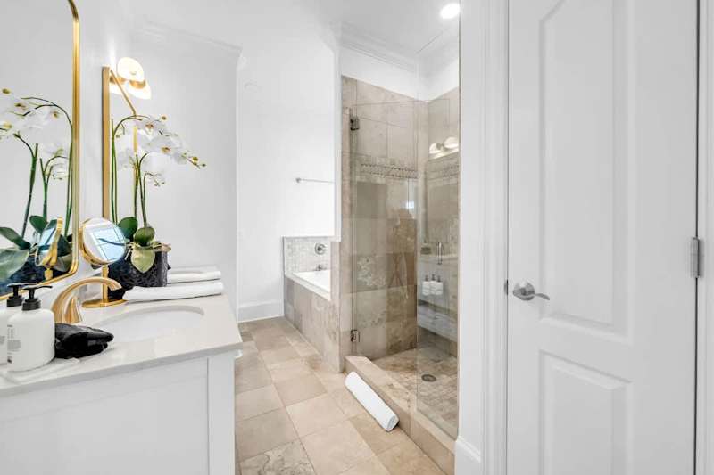 Bathroom features large walk-in shower and jetted tub