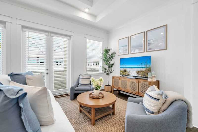 Living room features a queen sleeper sofa and smart tv