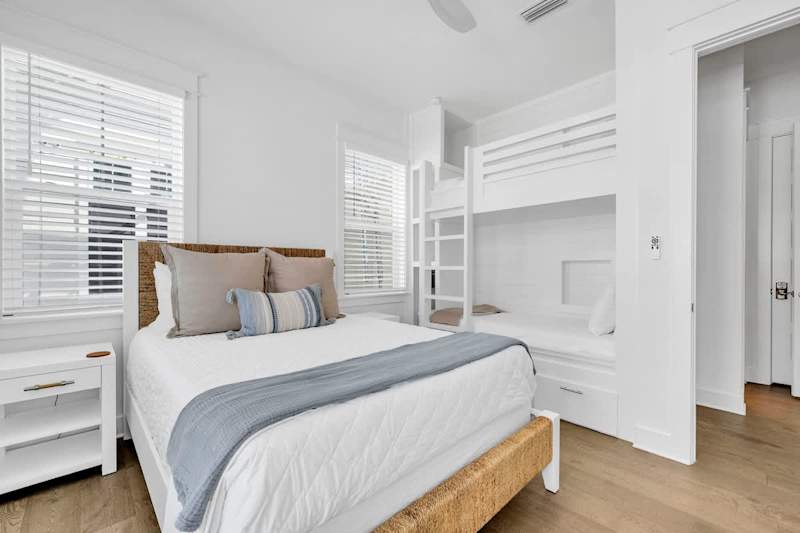 Queen bed + built in twin/twin bunk in guest bedroom.