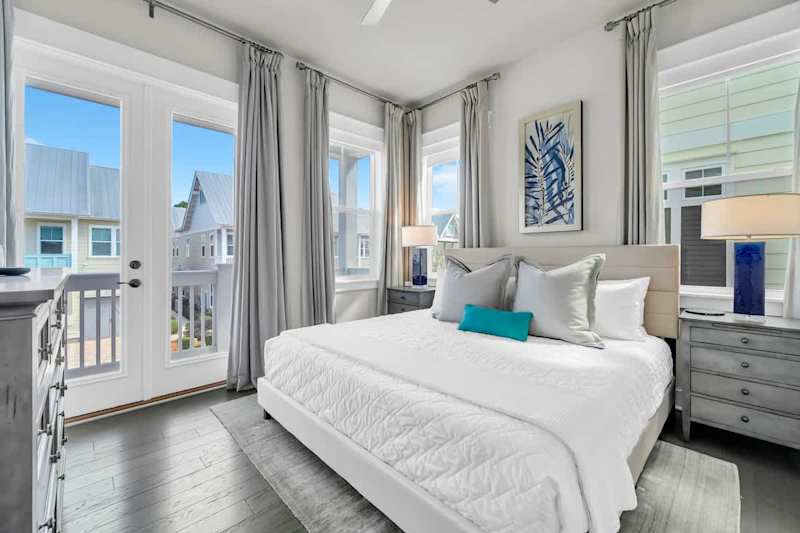 King bed in guest bedroom with private porch access