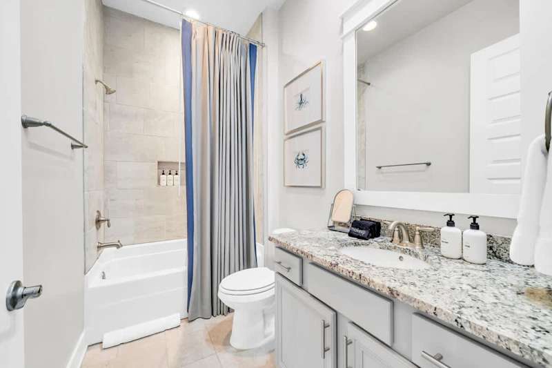 Guest bathroom features shower/tub combo