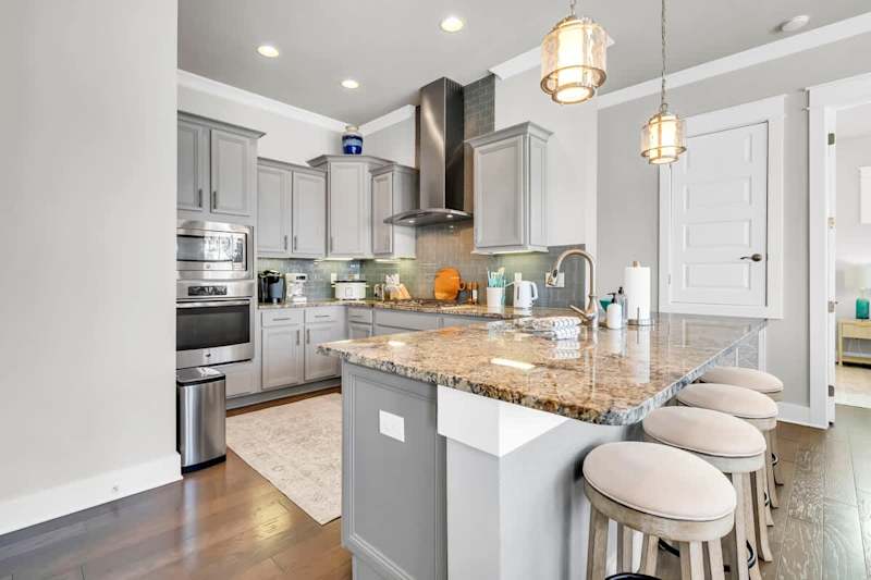 Enjoy the fully stocked kitchen with island seating
