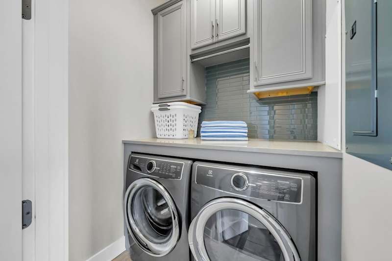 Custom built-in washer and dryer in unit