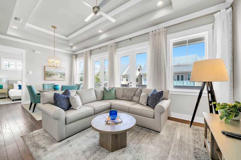 Living room features a large sectional & smart tv